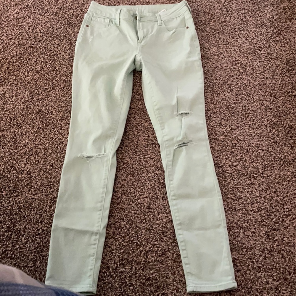 Distressed colored jeans